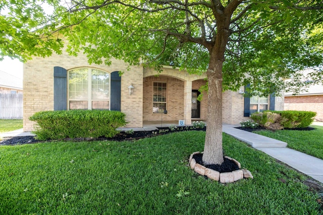 8603 Garden Way Dr, Amarillo, TX 79119 - view of front of property featuring a front yard and brick siding