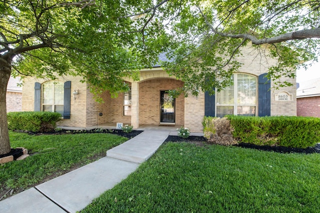 8603 Garden Way Dr, Amarillo, TX 79119 - view of front of house with a front lawn and brick siding