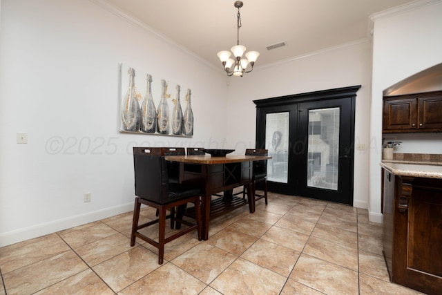 8603 Garden Way Dr, Amarillo, TX 79119 - dining space with crown molding, a chandelier, light tile patterned flooring, french doors, and baseboards