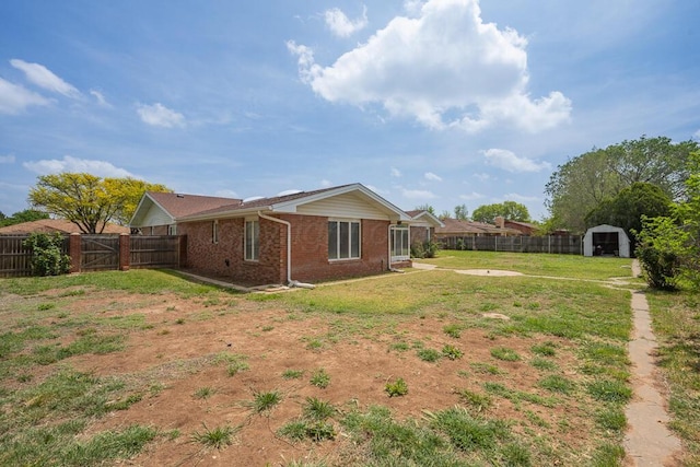 145 N Kingwood St, Hereford, TX 79045 - view of yard featuring a storage unit, a fenced backyard, and an outdoor structure