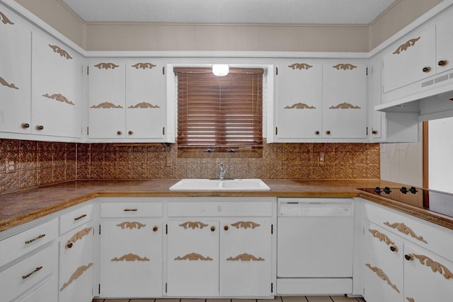 145 N Kingwood St, Hereford, TX 79045 - kitchen with decorative backsplash, a sink, custom range hood, and dishwasher