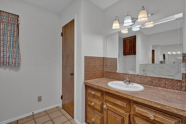 145 N Kingwood St, Hereford, TX 79045 - bathroom with baseboards, tile patterned flooring, and vanity