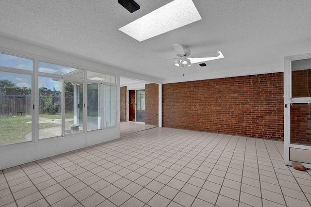 145 N Kingwood St, Hereford, TX 79045 - unfurnished sunroom featuring a skylight and ceiling fan