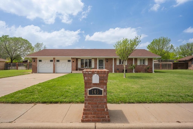 145 N Kingwood St, Hereford, TX 79045 - ranch-style home featuring fence, concrete driveway, and a front lawn