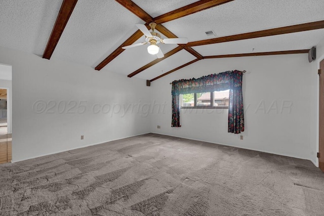 145 N Kingwood St, Hereford, TX 79045 - empty room with ceiling fan, a textured ceiling, visible vents, vaulted ceiling with beams, and carpet
