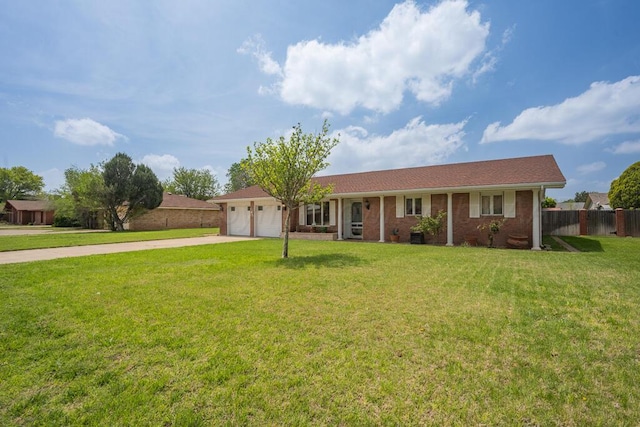 145 N Kingwood St, Hereford, TX 79045 - single story home featuring a garage, a front lawn, fence, brick siding, and driveway