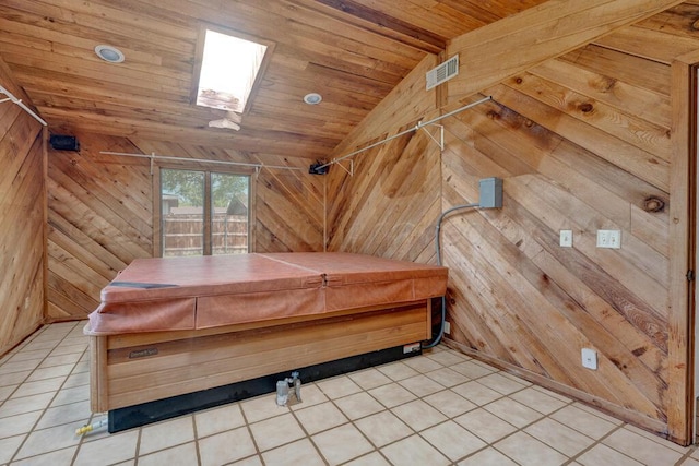 145 N Kingwood St, Hereford, TX 79045 - bedroom with wood walls, wooden ceiling, light tile patterned floors, and vaulted ceiling
