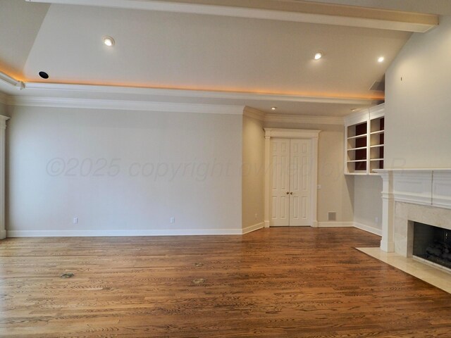 5105 Olsen Cir, Amarillo, TX 79106 - unfurnished living room with a fireplace, wood finished floors, crown molding, and recessed lighting