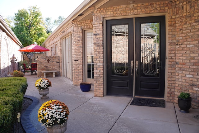 5105 Olsen Cir, Amarillo, TX 79106 - property entrance with brick siding, a patio, and french doors
