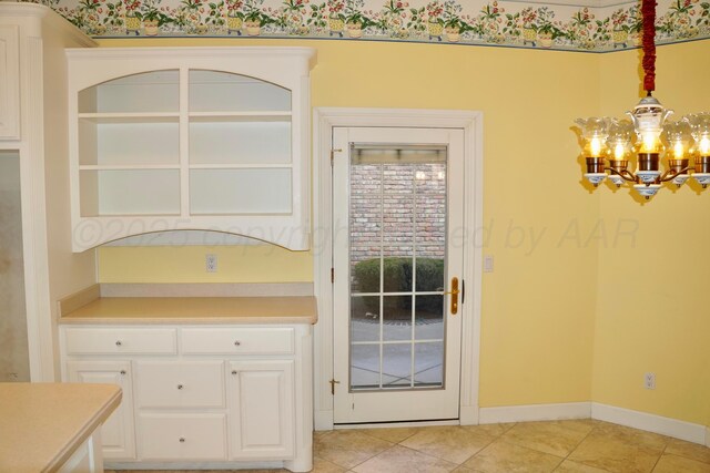 5105 Olsen Cir, Amarillo, TX 79106 - unfurnished dining area with a chandelier and light tile patterned floors
