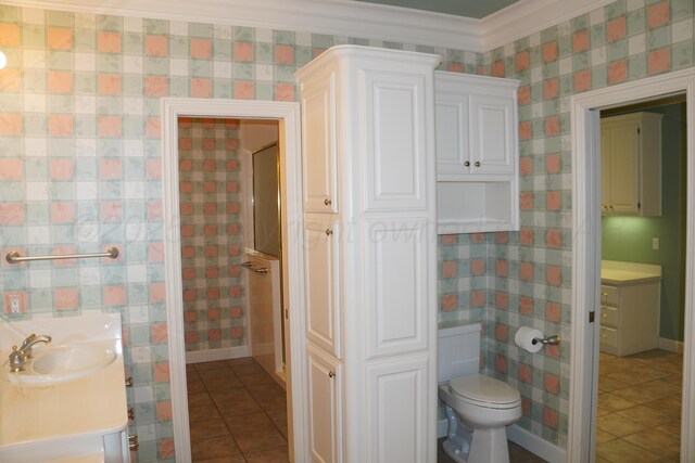 5105 Olsen Cir, Amarillo, TX 79106 - bathroom with tile patterned floors, vanity, and ornamental molding