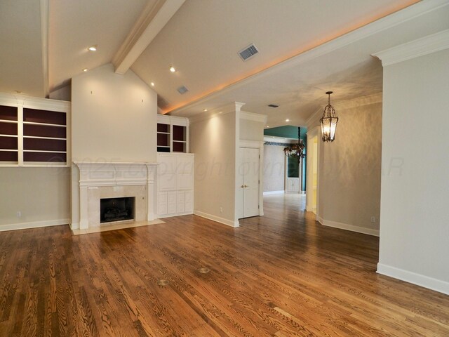5105 Olsen Cir, Amarillo, TX 79106 - unfurnished living room with a chandelier, wood finished floors, a high end fireplace, recessed lighting, and ornamental molding