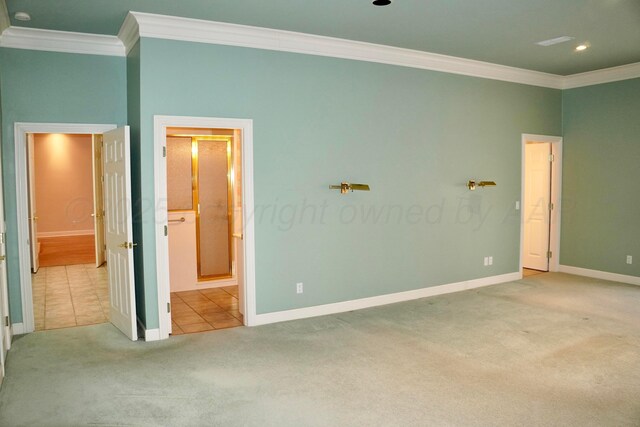 5105 Olsen Cir, Amarillo, TX 79106 - unfurnished bedroom featuring crown molding, carpet, tile patterned floors, ensuite bath, and recessed lighting