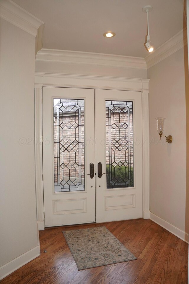 5105 Olsen Cir, Amarillo, TX 79106 - foyer with crown molding, french doors, plenty of natural light, wood finished floors, and recessed lighting