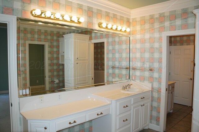 5105 Olsen Cir, Amarillo, TX 79106 - bathroom with double vanity, crown molding, tile patterned floors, and wallpapered walls