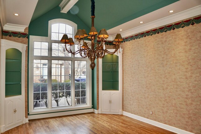 5105 Olsen Cir, Amarillo, TX 79106 - unfurnished dining area featuring ornamental molding, wallpapered walls, a chandelier, wood finished floors, and lofted ceiling