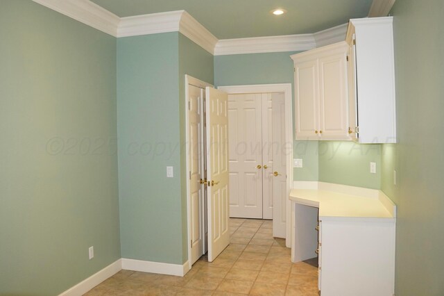 5105 Olsen Cir, Amarillo, TX 79106 - kitchen with crown molding, white cabinets, light countertops, recessed lighting, and light tile patterned floors