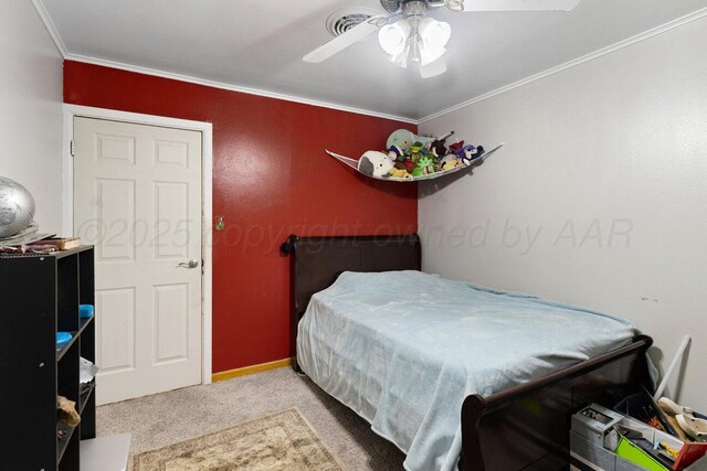 2209 N Beech Ln, Pampa, TX 79065 - carpeted bedroom with crown molding, a ceiling fan, and baseboards