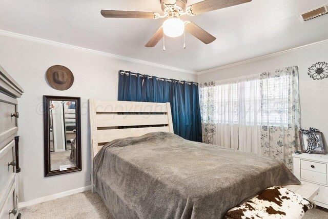 2209 N Beech Ln, Pampa, TX 79065 - bedroom with ornamental molding, baseboards, a ceiling fan, and carpet floors
