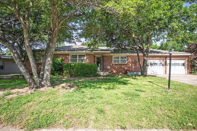 2209 N Beech Ln, Pampa, TX 79065 - single story home featuring a garage, brick siding, a front yard, and concrete driveway