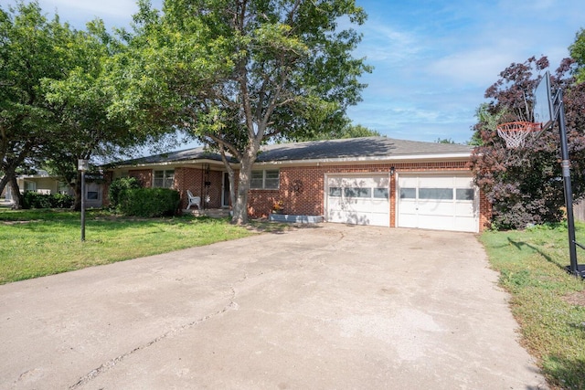2209 N Beech Ln, Pampa, TX 79065 - ranch-style house with a garage, a front lawn, brick siding, and driveway