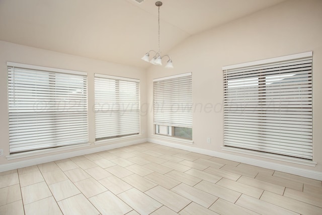 7308 Sinclair St, Amarillo, TX 79119 - unfurnished dining area with a chandelier and vaulted ceiling