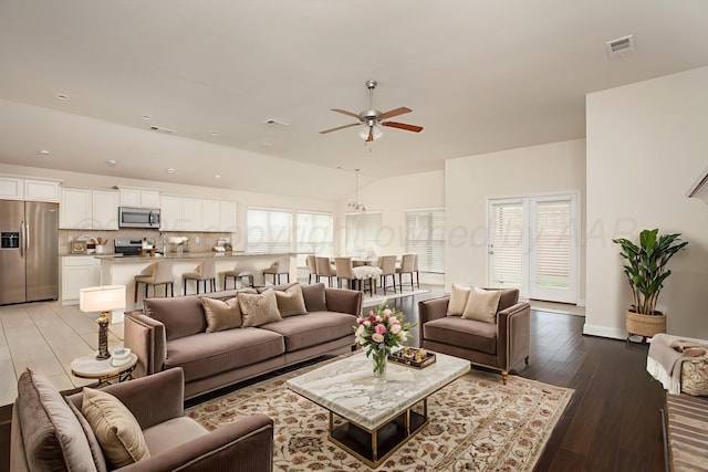 7308 Sinclair St, Amarillo, TX 79119 - living room featuring ceiling fan, light wood-type flooring, and vaulted ceiling
