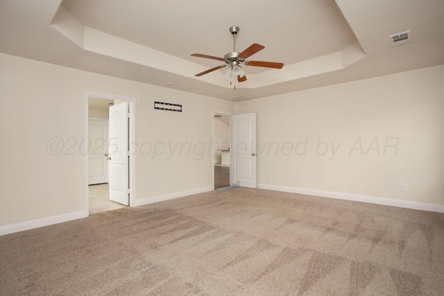 7308 Sinclair St, Amarillo, TX 79119 - carpeted empty room featuring a tray ceiling and ceiling fan