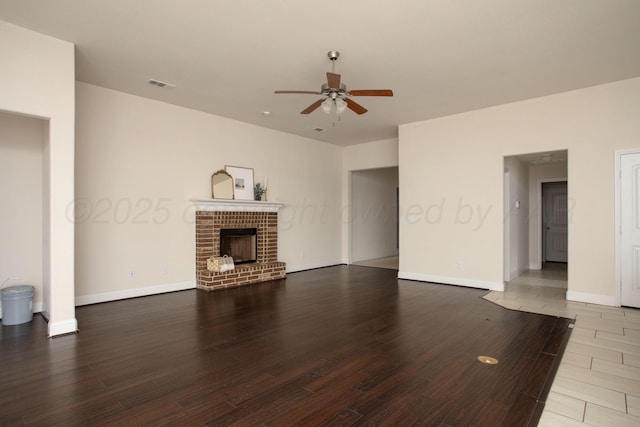 7308 Sinclair St, Amarillo, TX 79119 - unfurnished living room featuring ceiling fan, wood finished floors, and a fireplace