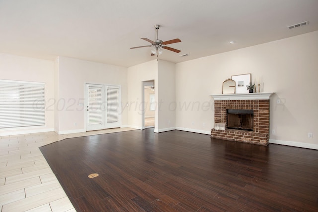 7308 Sinclair St, Amarillo, TX 79119 - unfurnished living room featuring a ceiling fan, wood finished floors, and a brick fireplace