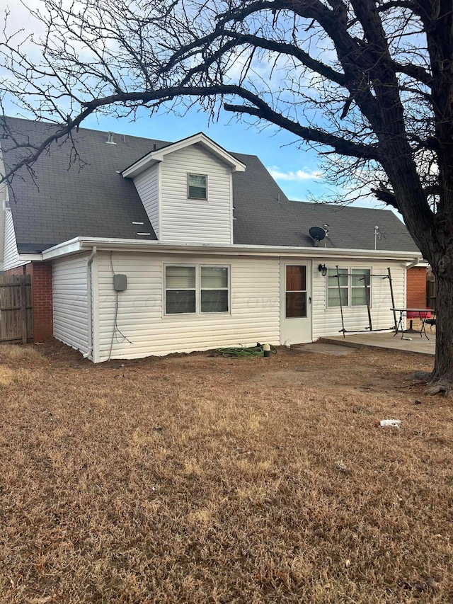 605 Star St, Hereford, TX 79045 - back of property with a patio area and roof with shingles