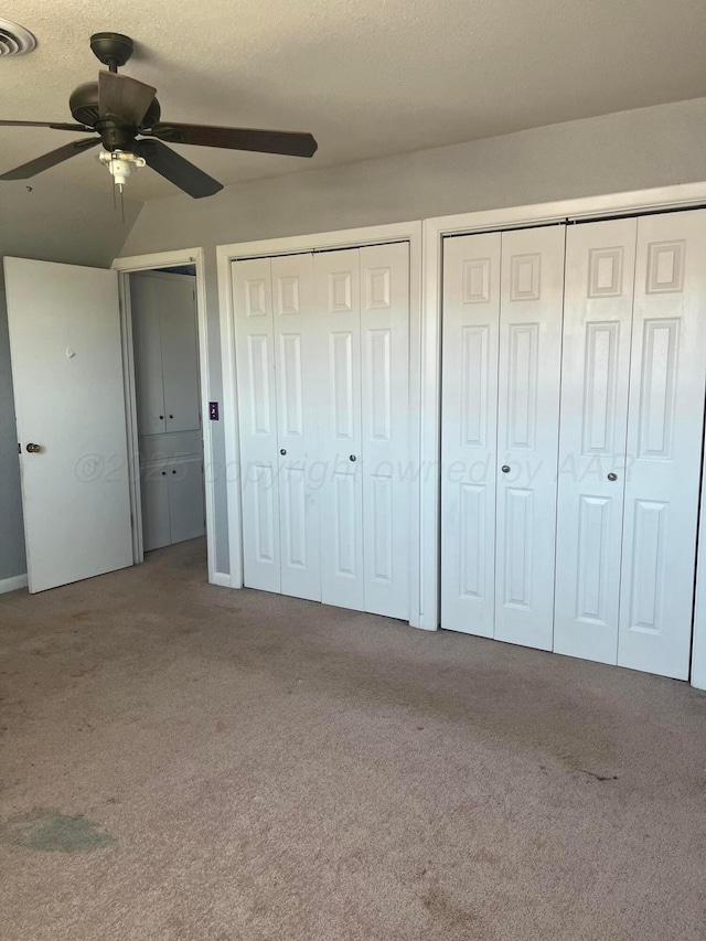 605 Star St, Hereford, TX 79045 - unfurnished bedroom with multiple closets, carpet floors, and ceiling fan