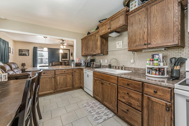 4114 S Hayden St, Amarillo, TX 79119 - kitchen featuring white appliances, open floor plan, decorative backsplash, a ceiling fan, and light tile patterned floors