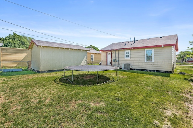 4114 S Hayden St, Amarillo, TX 79119 - back of house with a trampoline and a storage unit