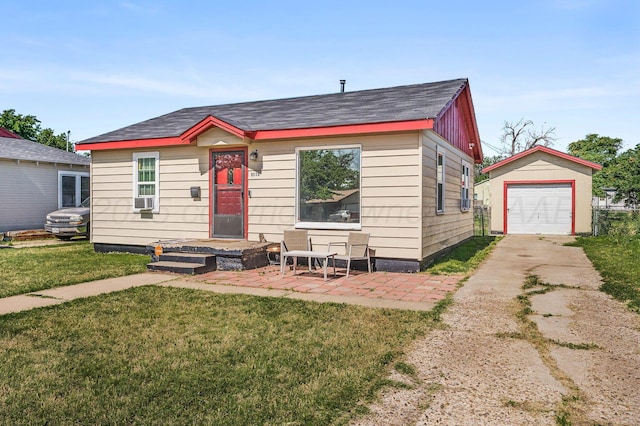4114 S Hayden St, Amarillo, TX 79119 - bungalow with concrete driveway, an outdoor structure, a front yard, and cooling unit