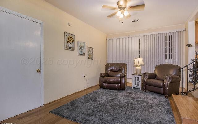 3406 Patterson Dr, Amarillo, TX 79109 - living area with wood finished floors and a ceiling fan