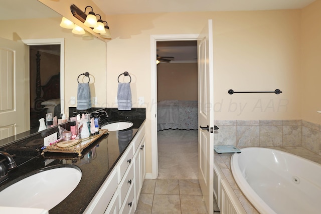 6501 Nancy Ellen St, Amarillo, TX 79119 - ensuite bathroom featuring double vanity, a tub with jets, and tile patterned flooring