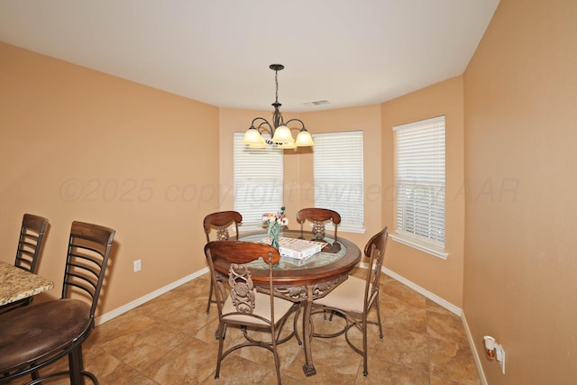 6501 Nancy Ellen St, Amarillo, TX 79119 - dining room featuring a chandelier and baseboards