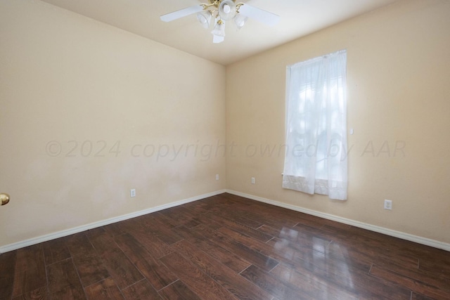 unfurnished room featuring ceiling fan and dark hardwood / wood-style floors