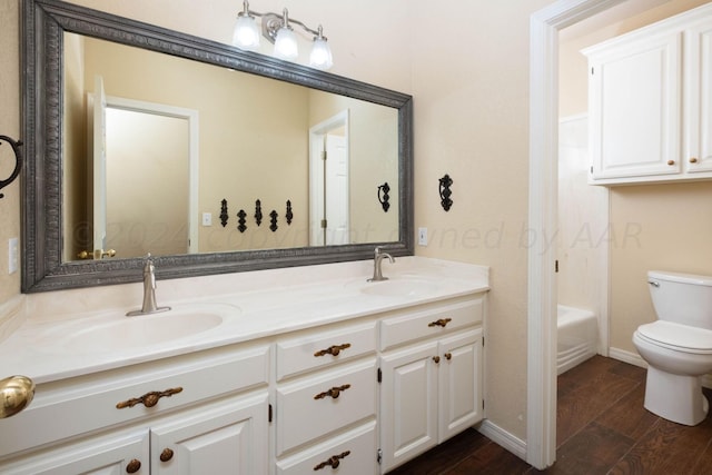 full bathroom with toilet, shower / tub combination, vanity, and hardwood / wood-style floors