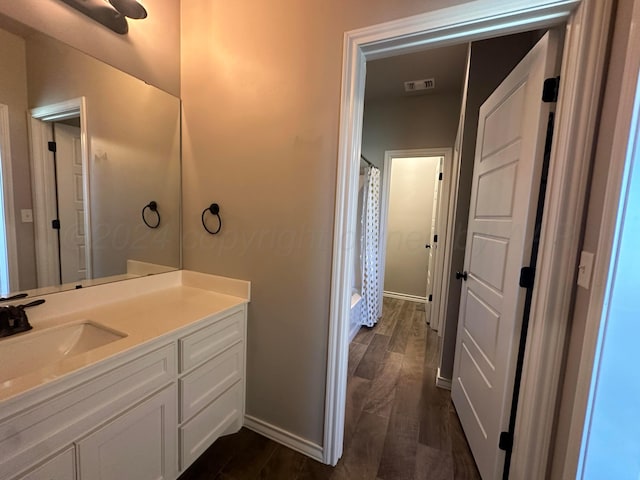 17901 19th St, Amarillo, TX 79124 - full bathroom featuring vanity, wood finished floors, and baseboards