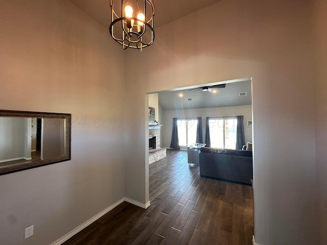 17901 19th St, Amarillo, TX 79124 - corridor with dark wood finished floors, baseboards, a chandelier, and a high ceiling