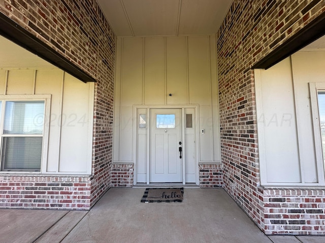 17901 19th St, Amarillo, TX 79124 - view of exterior entry with board and batten siding and brick siding