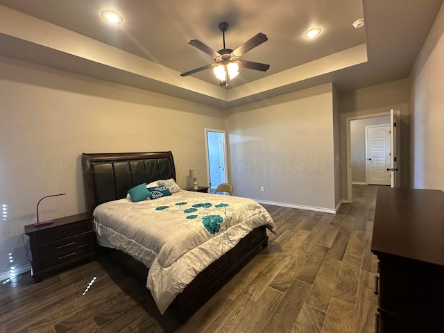 17901 19th St, Amarillo, TX 79124 - bedroom with a raised ceiling, baseboards, dark wood-style floors, recessed lighting, and ceiling fan
