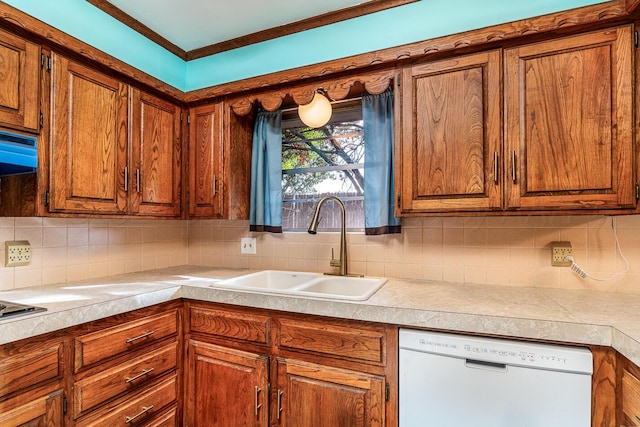 kitchen featuring decorative backsplash, sink, and white dishwasher