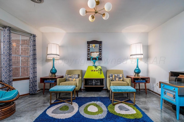 living area featuring a notable chandelier