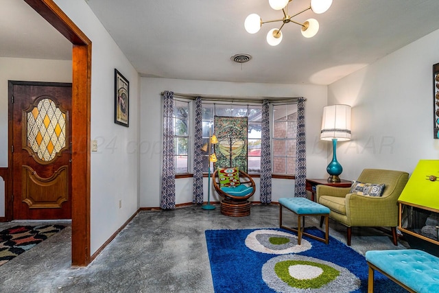 living area featuring carpet and a notable chandelier