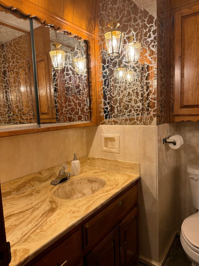 bathroom with vanity and toilet