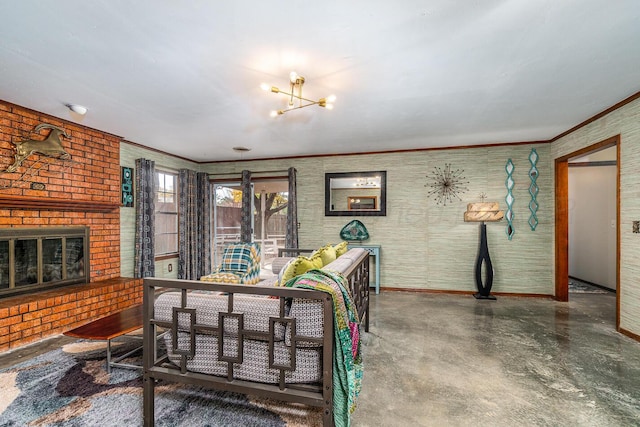 living room with a notable chandelier, crown molding, and a brick fireplace