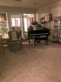 sitting room featuring carpet flooring